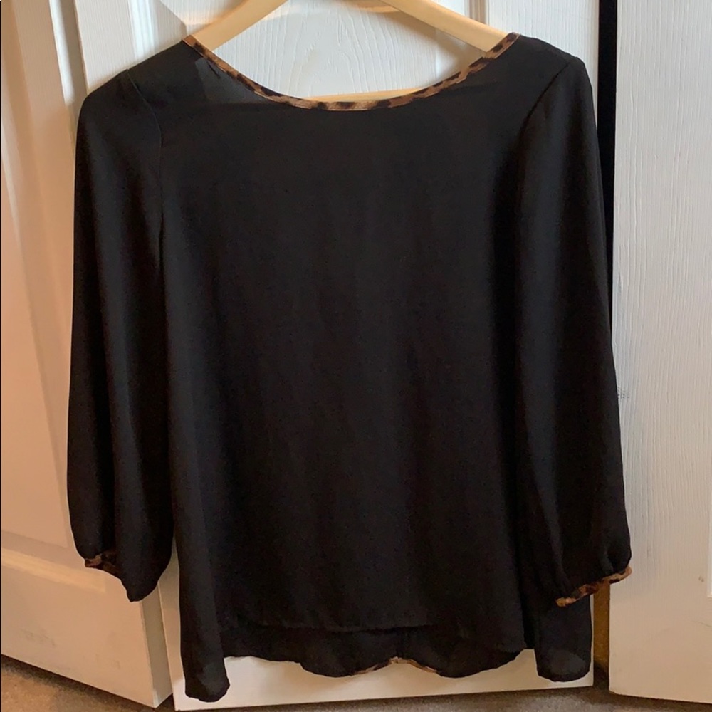 Sheer black top with leopard bow
